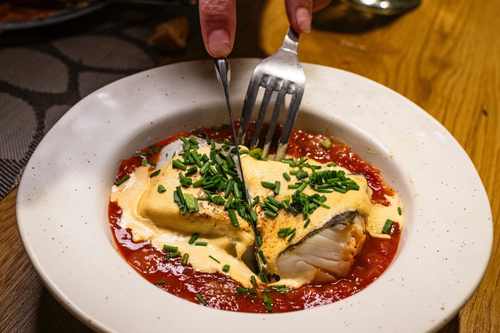 Bacalao con asadillo de pimiento al estilo manchego.