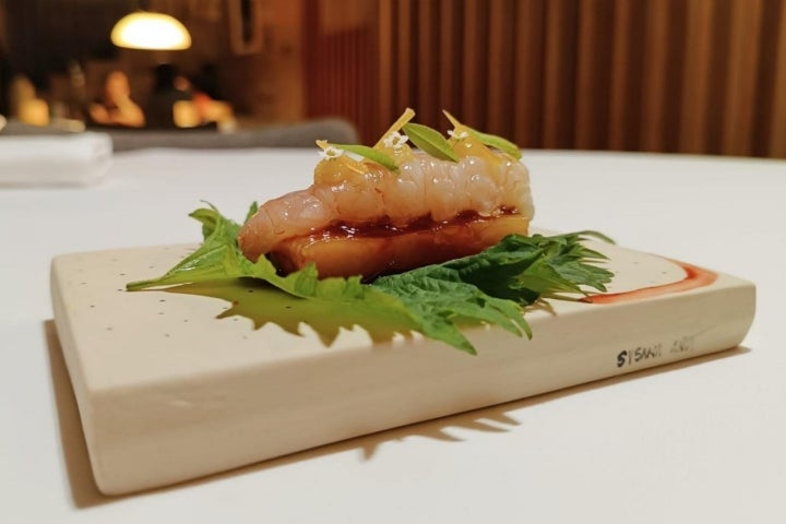 Plato de papada, cigala y limón en A Tafona