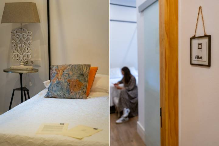 Cama y detalle del nombre de una habitación del hotel Luz Almonaster