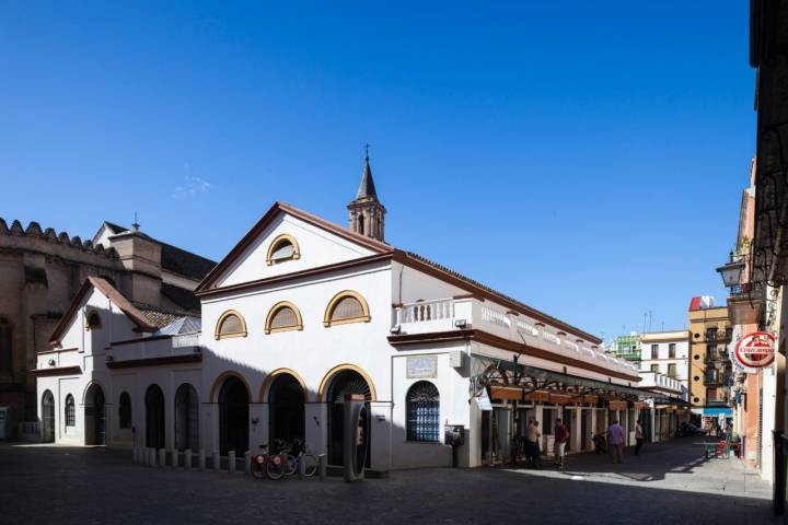 Feria street marketplace and Omnium Sanctorum church (13th century), Seville, Spain