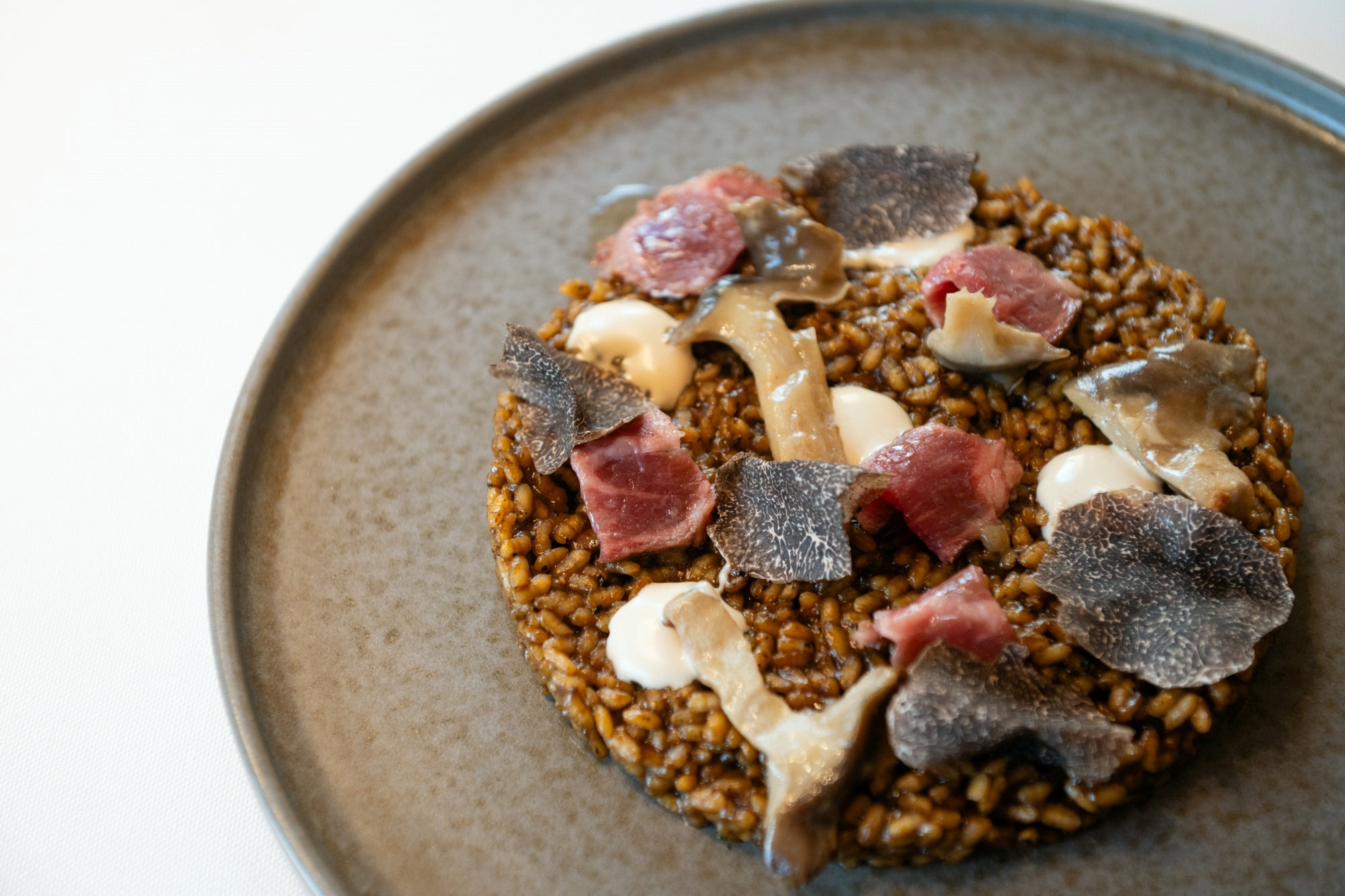 Arroz meloso con presa ibérica y trufa.